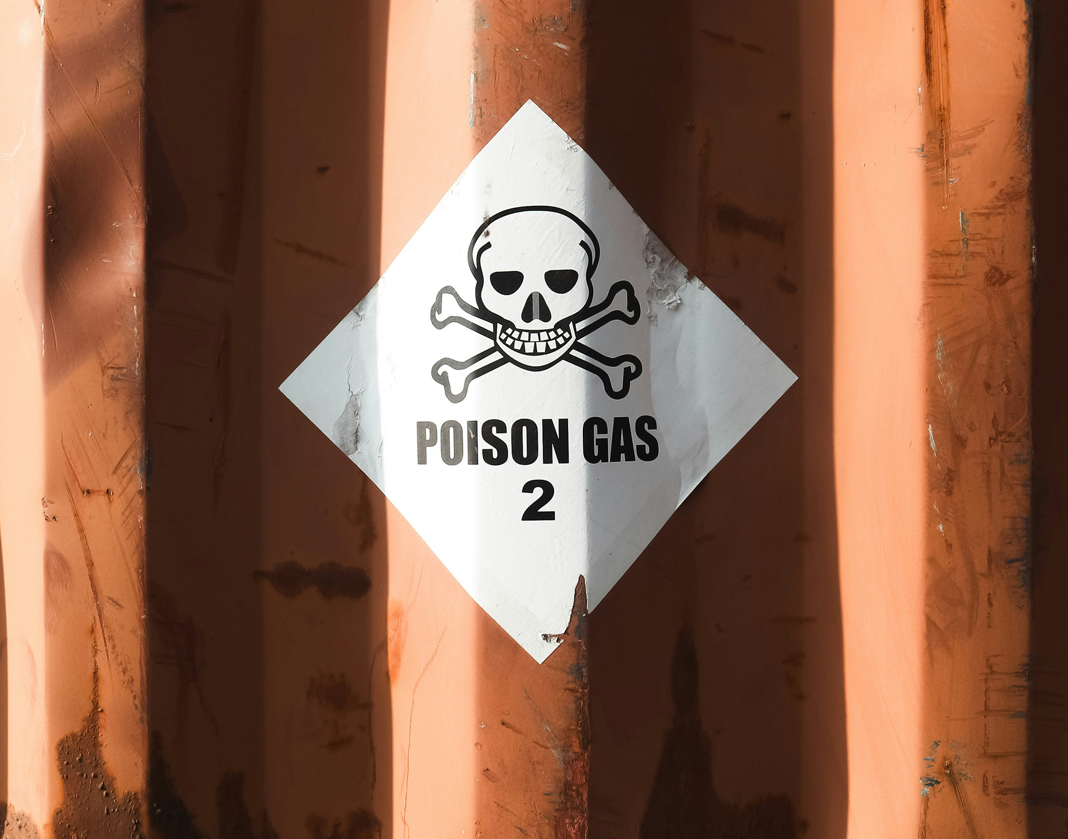 A label "poison gas" on a container