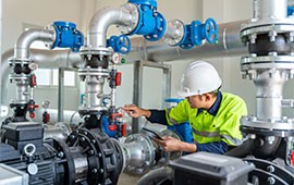 Engineer carrying out checks on a pump