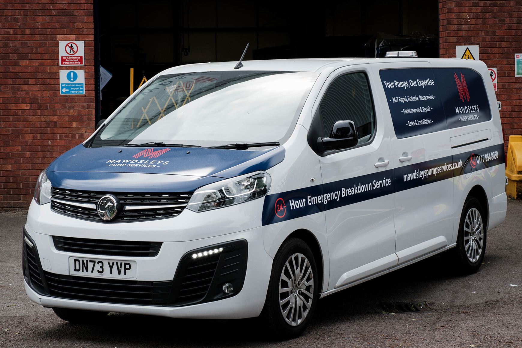 A photo of one of our vans in front of our HQ