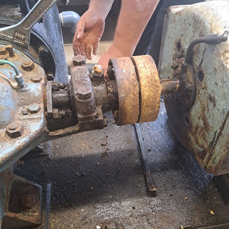 An image of one of our engineers removing a rusty equipment