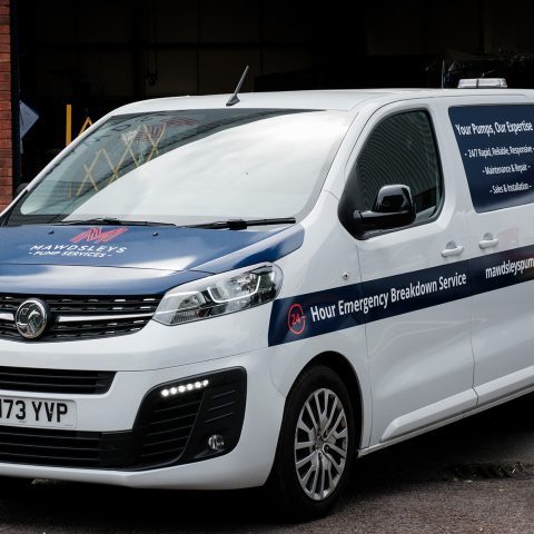 A photo of one of our vans in front of our HQ
